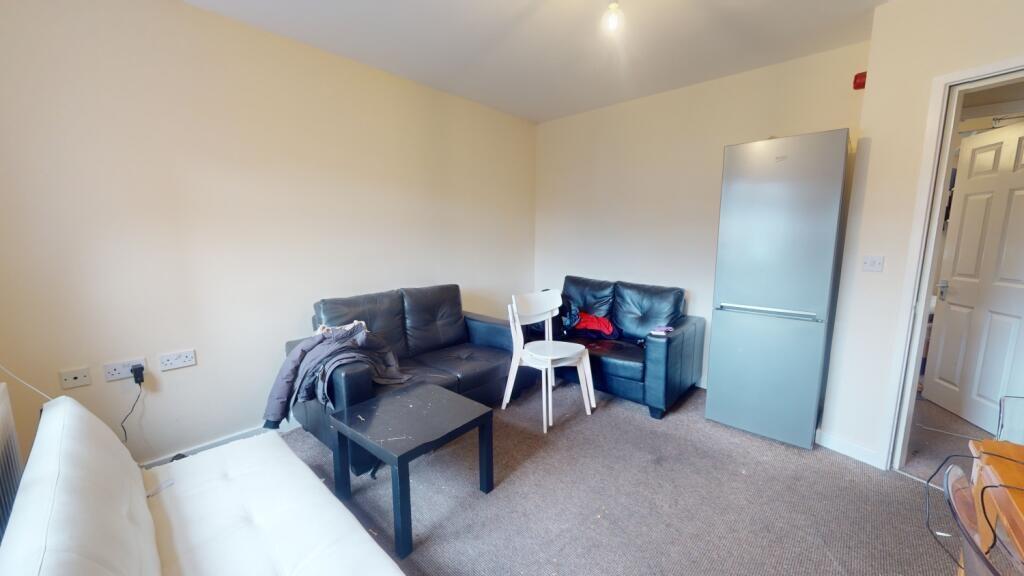 A cozy living room featuring comfortable seatin...