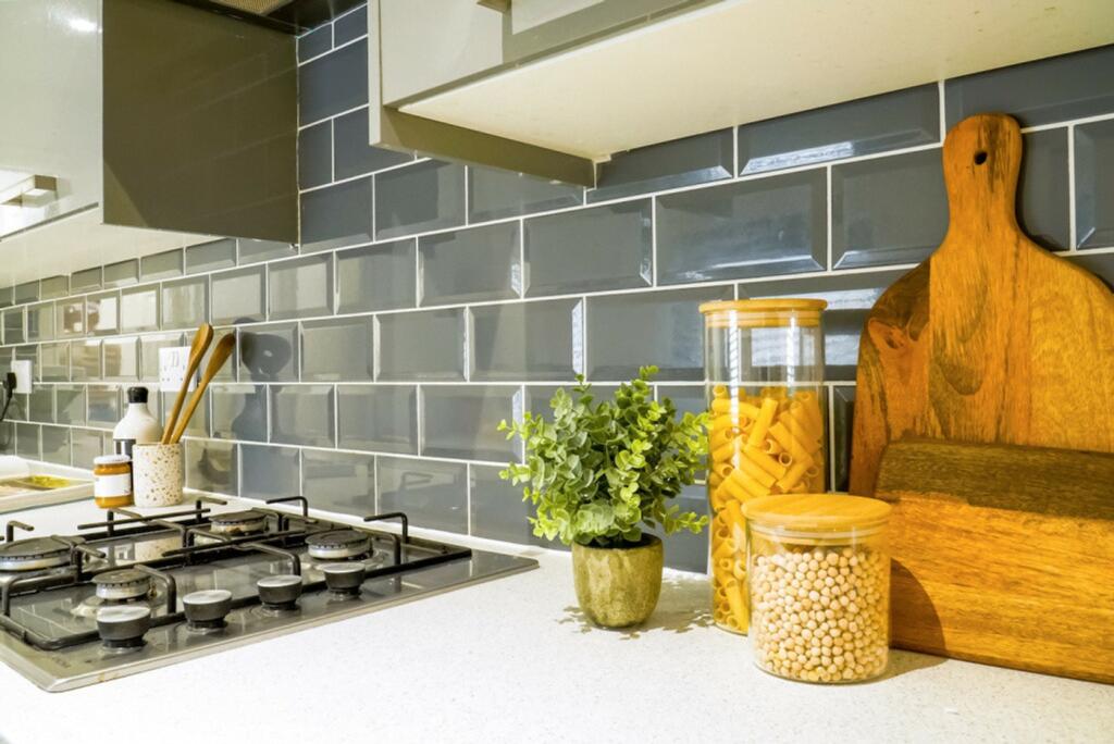 A modern and tidy kitchenette with stylish deco...
