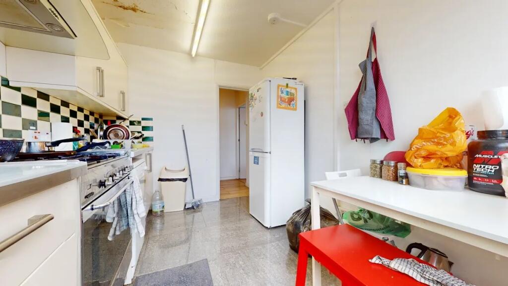 Bright kitchen with modern appliances and a cle...
