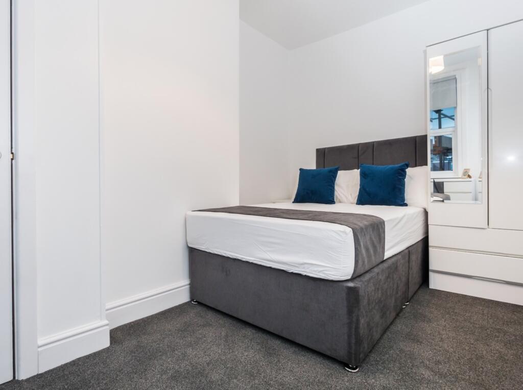 A stylish and inviting double bedroom featuring...