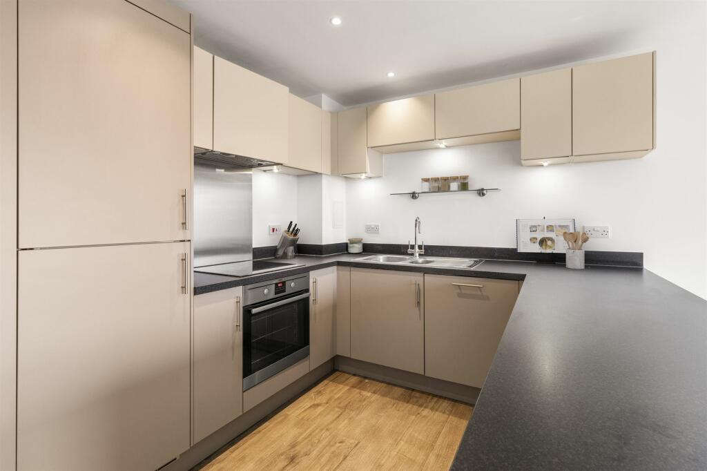 Experience the harmony of style and utility in this modern kitchen space.