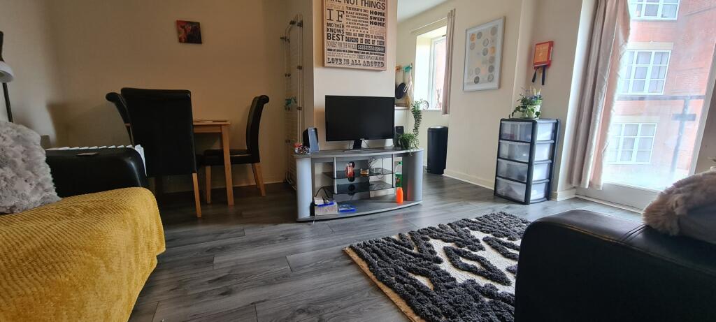 A spacious and inviting living room filled with...