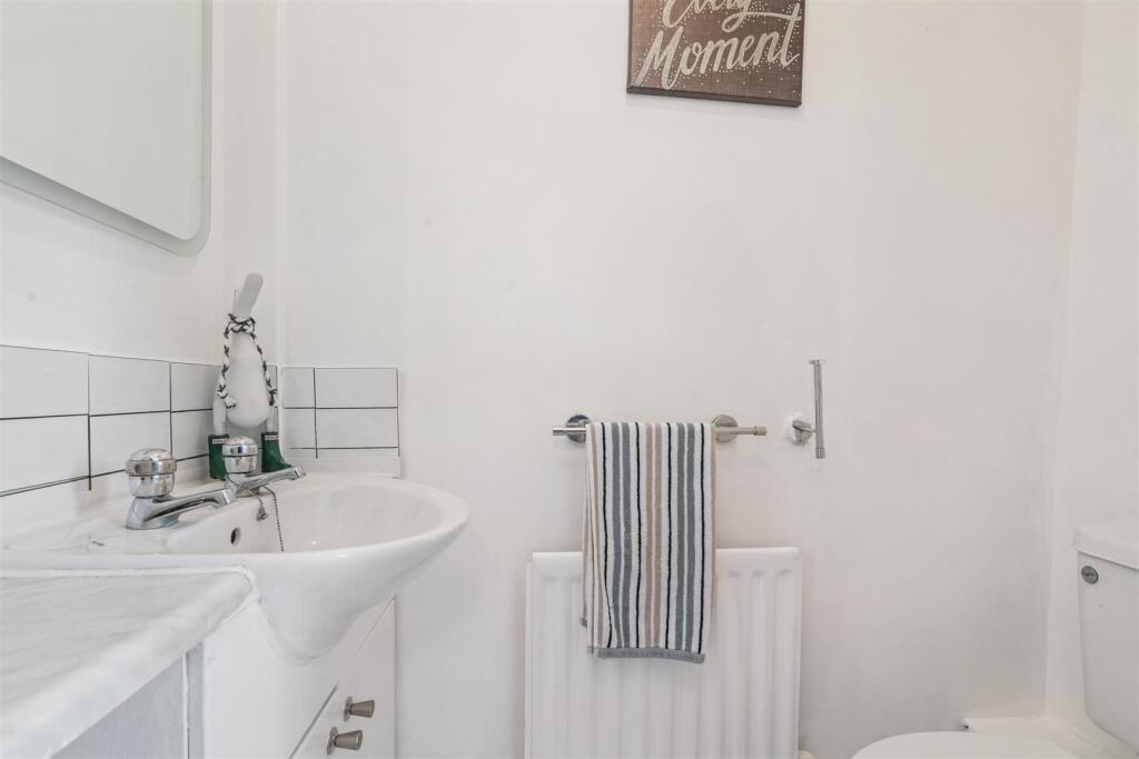 147 Sutton Common Road bathroom.jpg