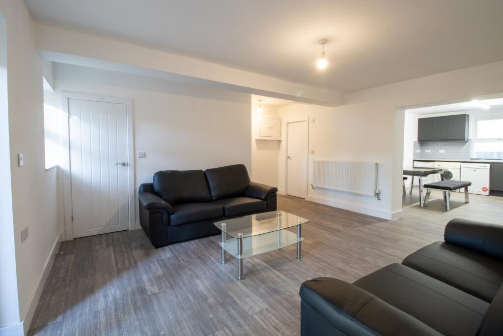 Bright and spacious living room with modern dec...