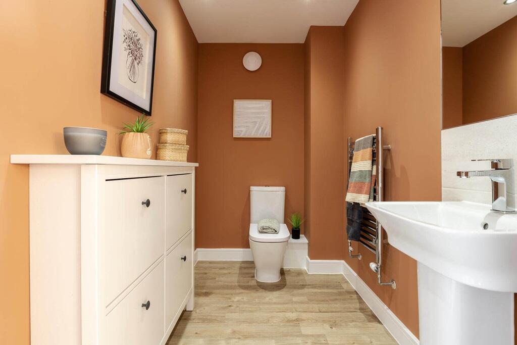 A handy ground floor cloakroom offers room for additional storage