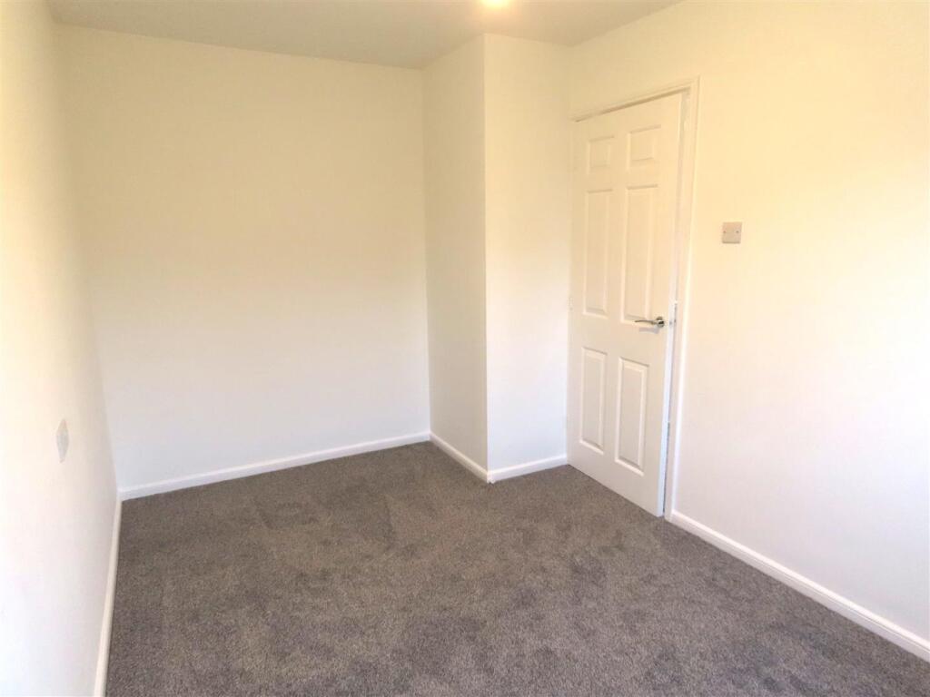 MAIN REAR BEDROOM