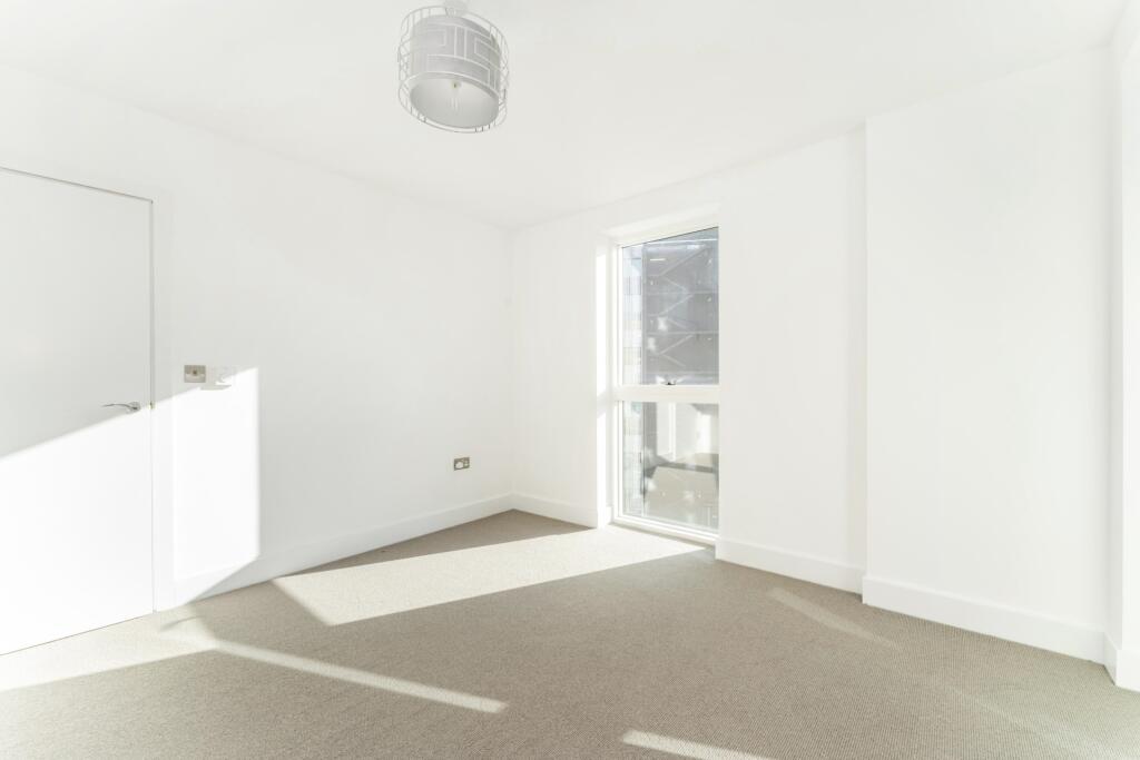 Bright and airy single bedroom featuring large ...