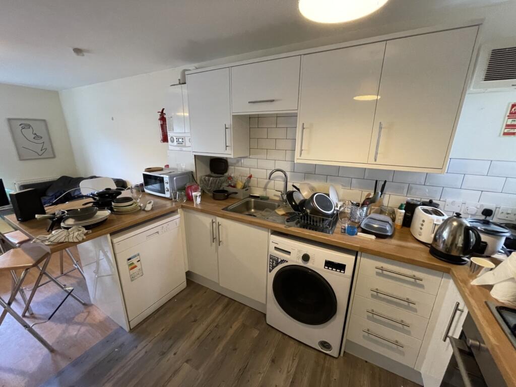 Bright and functional kitchen space featuring a...