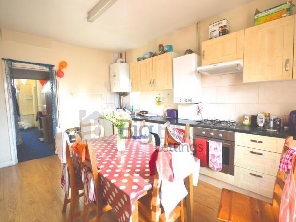 Bright and welcoming kitchen featuring ample ca...