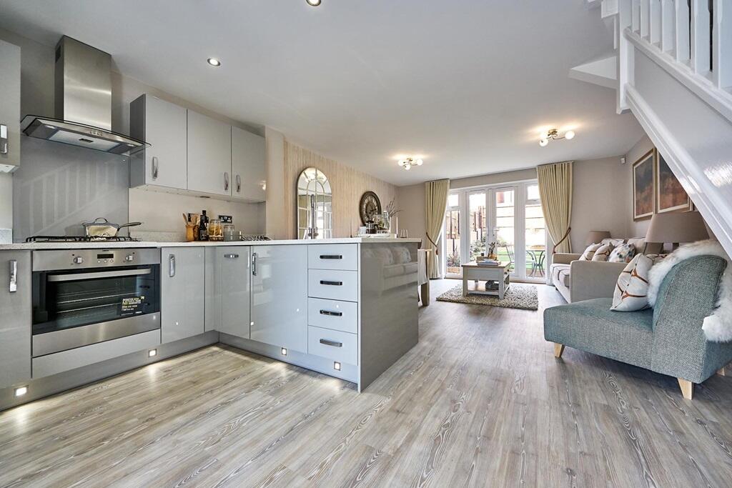 French doors fill the lounge with light, that travels through the home