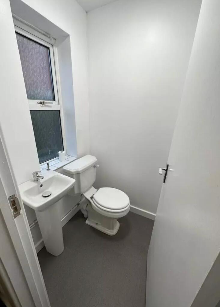 A tidy and well-maintained single toilet with n...