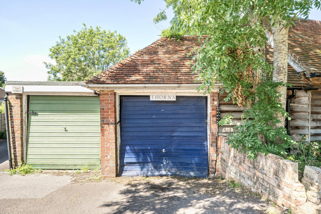 Garage with off road parking for one vehicle in front