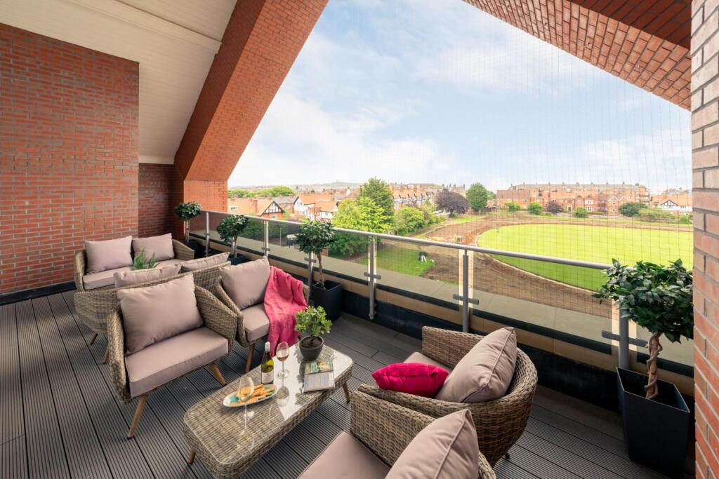 Enjoying a drink on thesunlounge balcony 