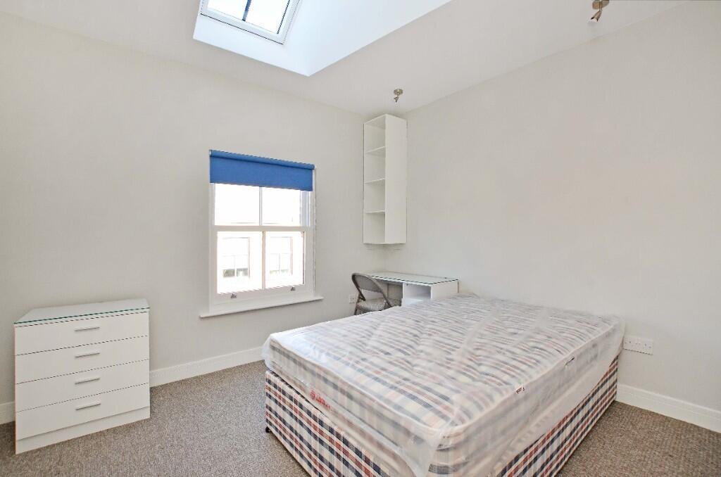 Bright and tidy double bedroom featuring a comf...