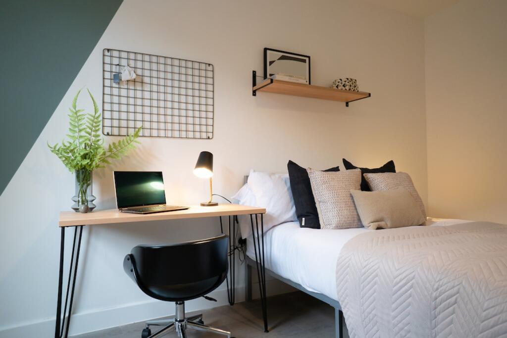 A stylish and inviting double bedroom with a co...