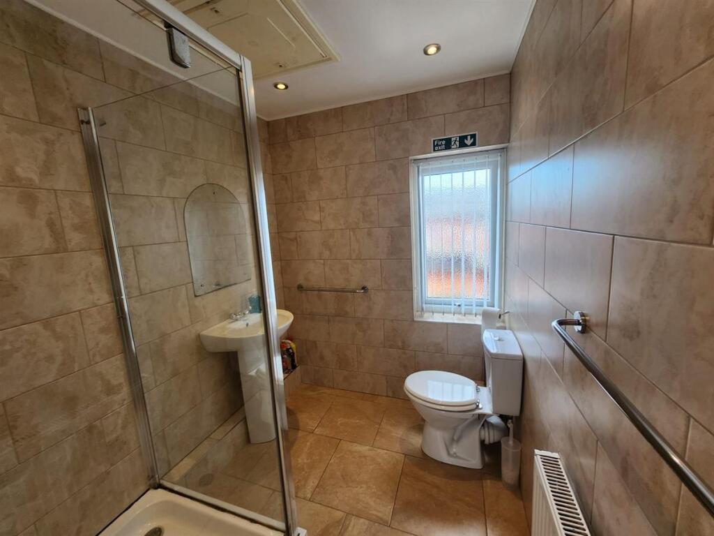 A clean and well-maintained bathroom featuring ...
