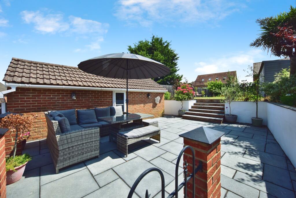 Landscaped Private Rear Patio Area With Garage View