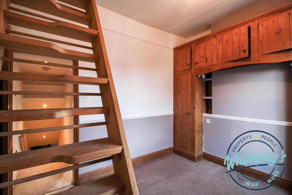 Front bedroom with ladder to first floor