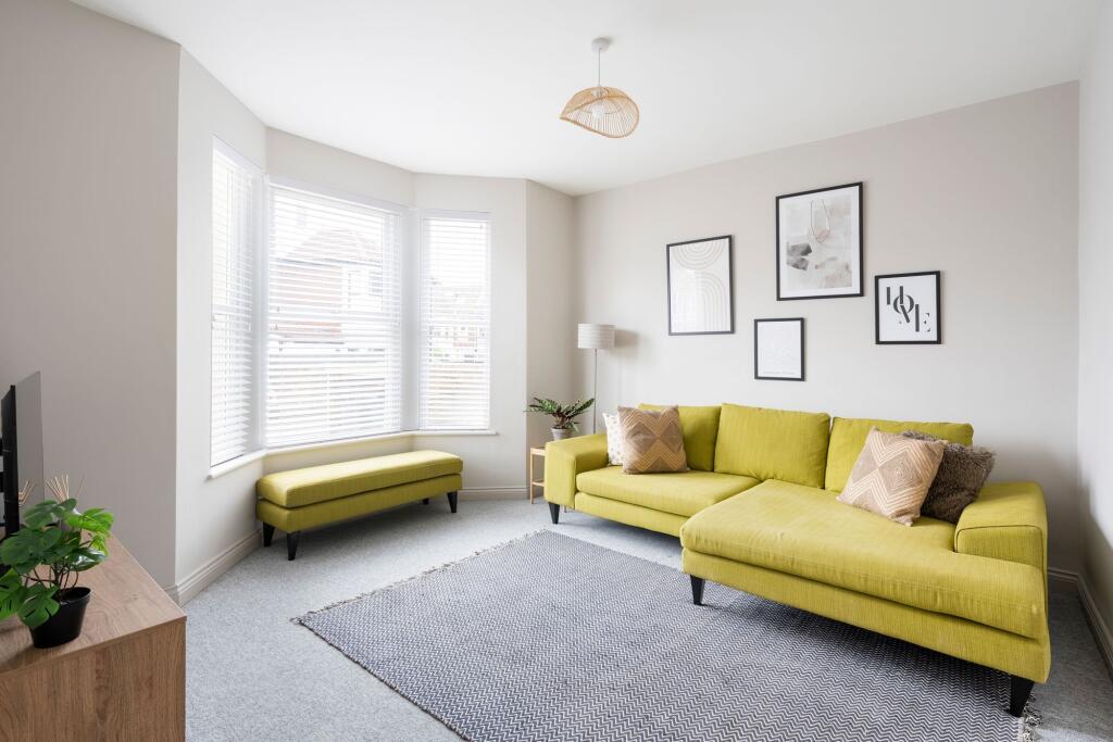 Bright contemporary living room with a large ba...