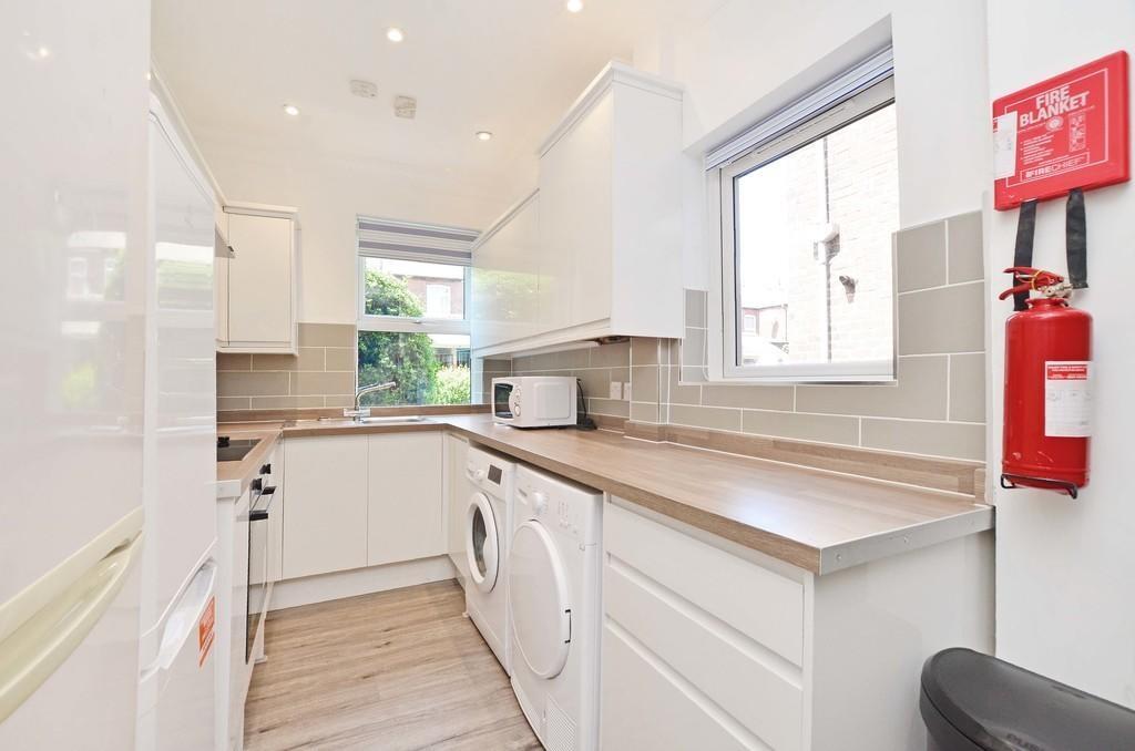 Bright and modern kitchen with ample countertop...