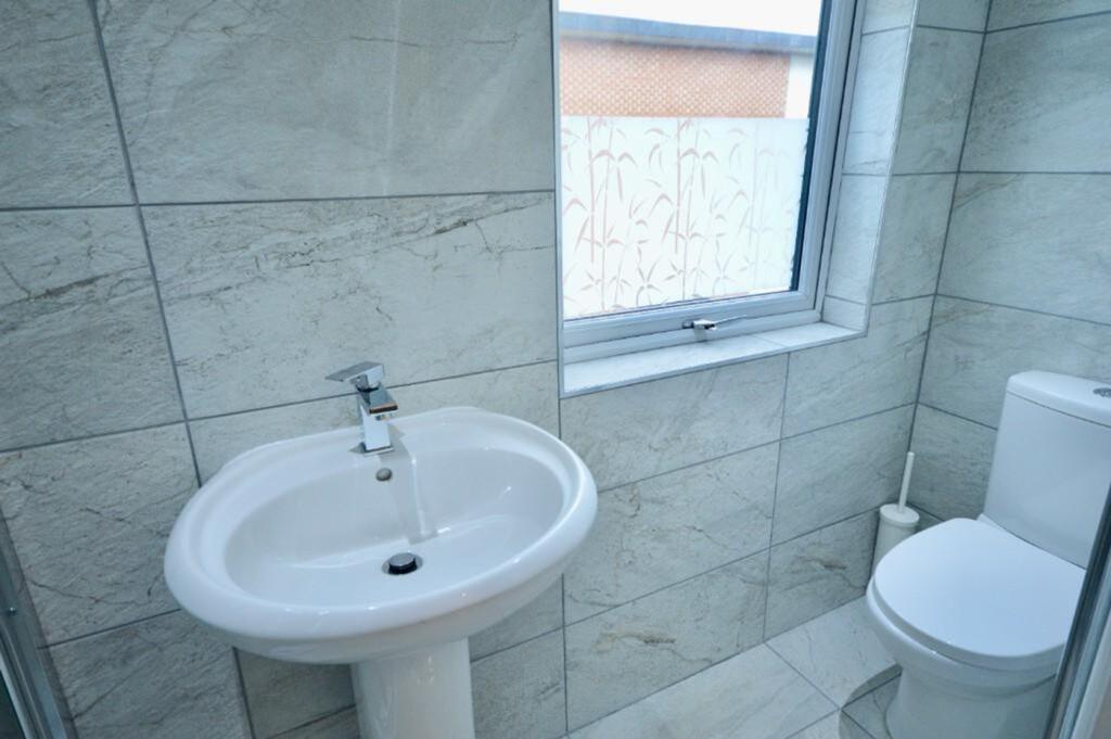 A modern and clean bathroom featuring stylish t...