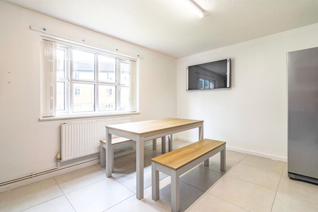 Bright and spacious kitchen area featuring a mo...