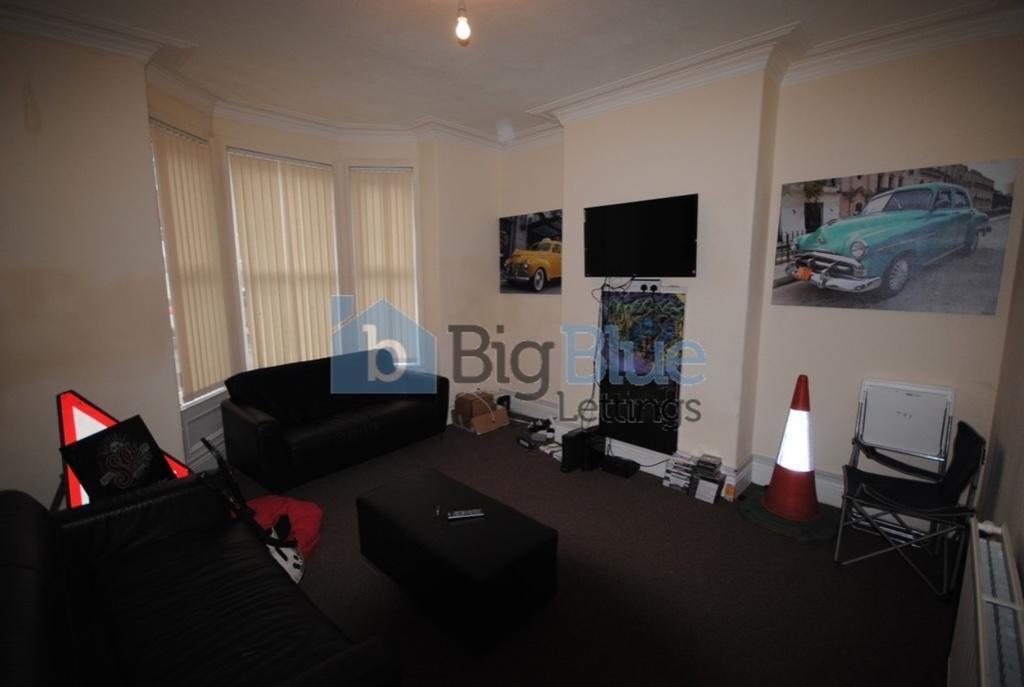 Contemporary living room with comfortable black...