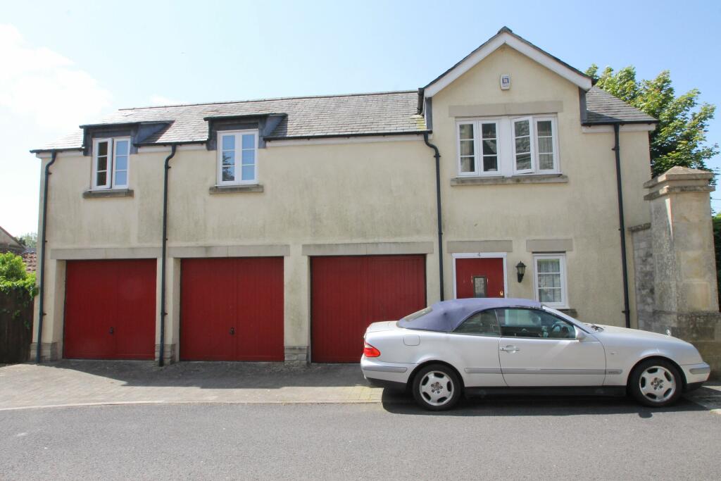 Middle garage of the three shown