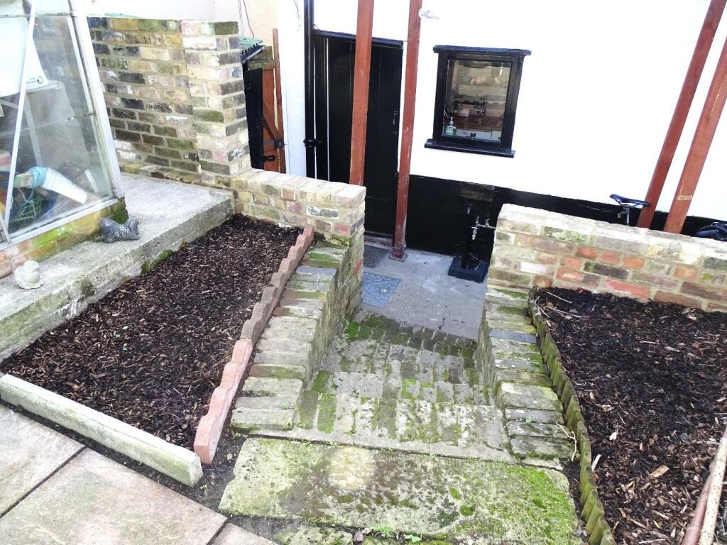 STEPS DOWN TO KITCHEN DOOR