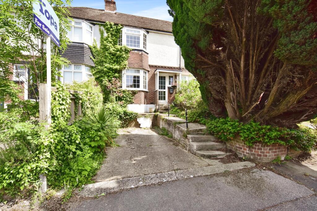 Front View Of The Property With Driveway Parking