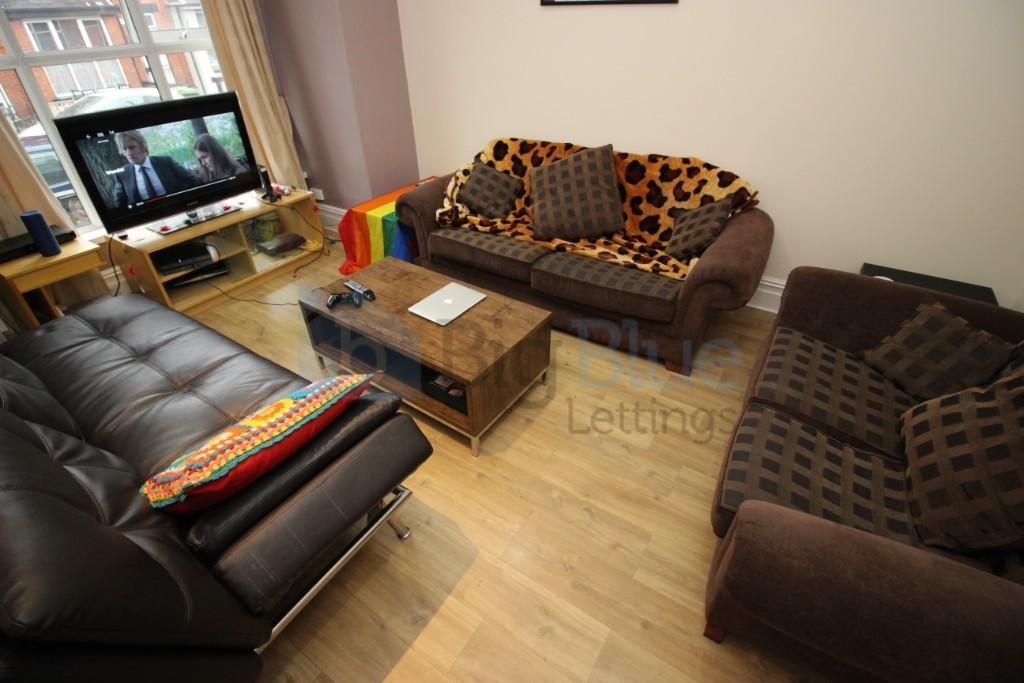A cozy living room featuring a combination of s...