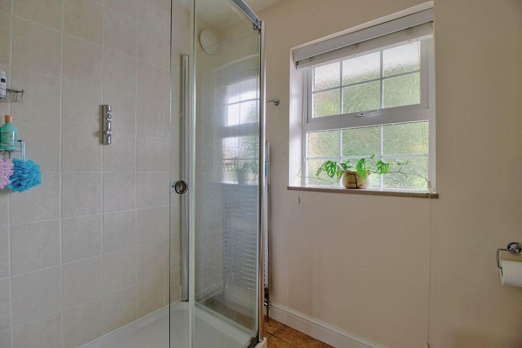 En-suite with large shower enclosure