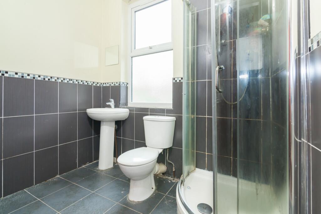 Bright and modern bathroom featuring a sleek sh...