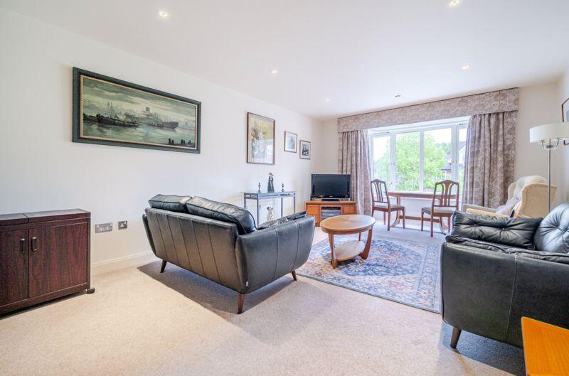 Living/dining room with bay window