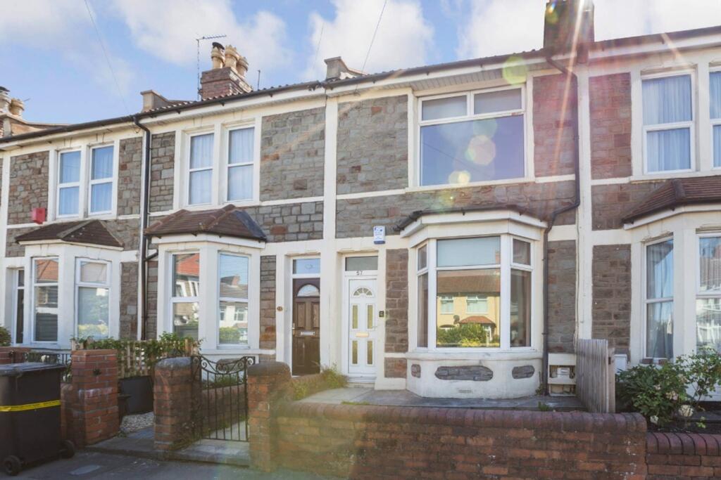 A charming terraced house featuring a beautiful...