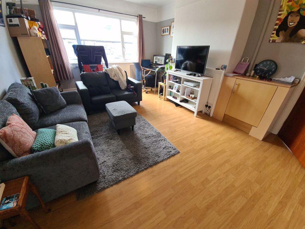 Bright, contemporary living room with comfortab...