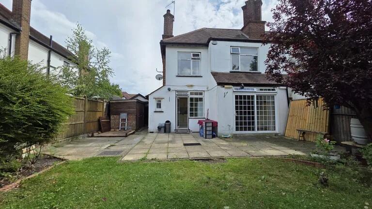 Rear view of a charming semi-detached house fea...