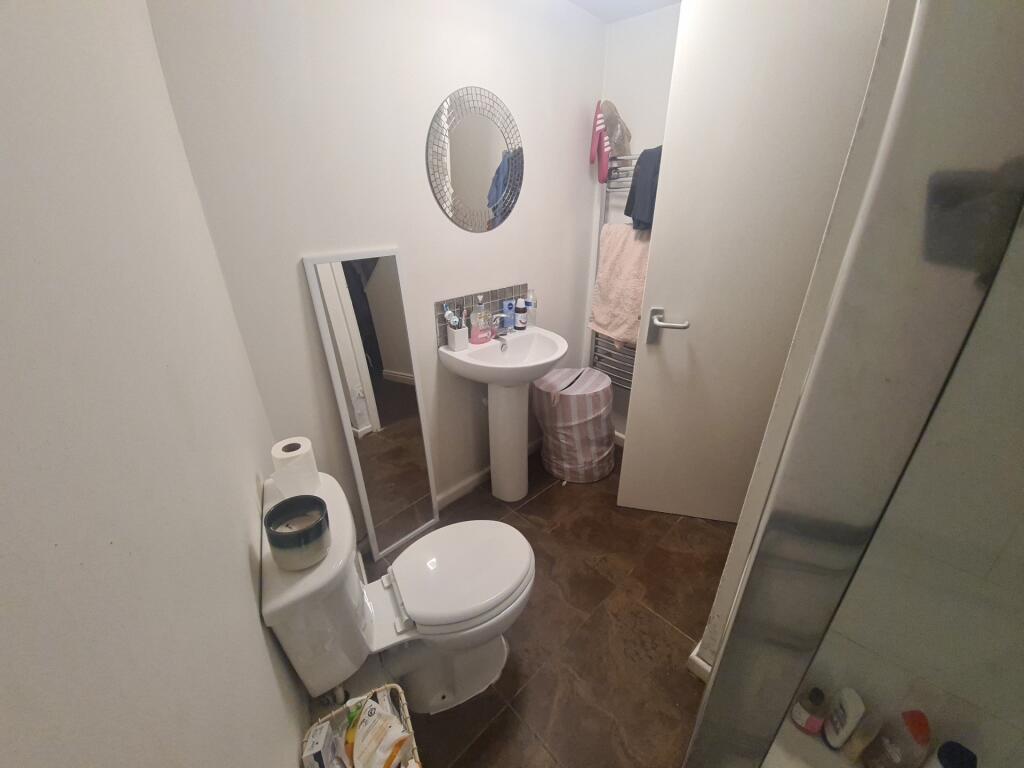 A clean and well-maintained bathroom featuring ...