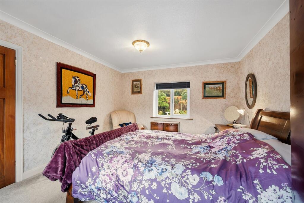 Bedroom One - bed and rear window.jpg