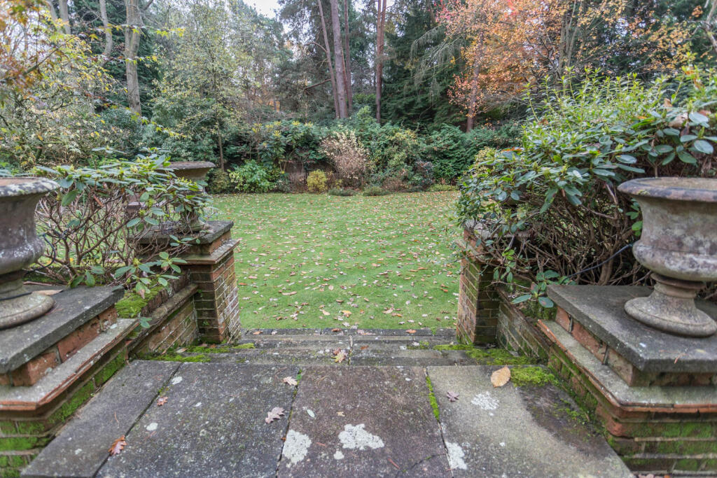 Steps from private patio to gardens