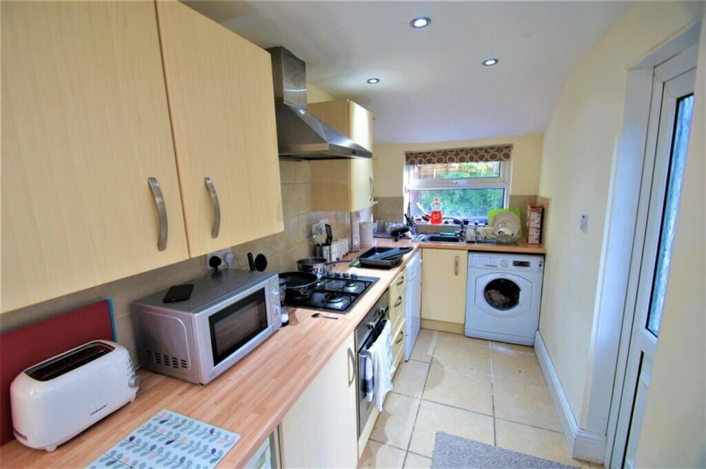 Charming kitchen with modern appliances, ample ...