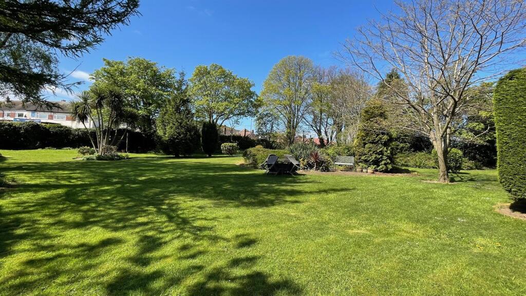 COMMUNAL GARDENS AND PARKING AREA