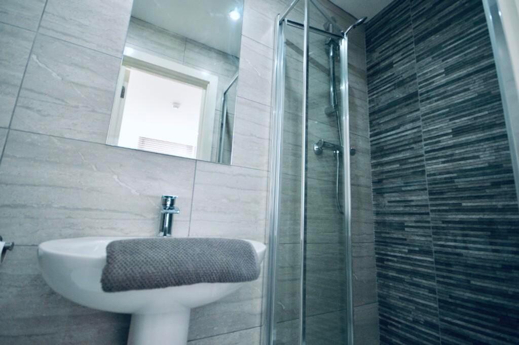 A modern and stylish bathroom featuring a sleek...