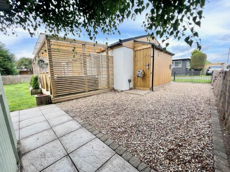 Driveway and across the rear