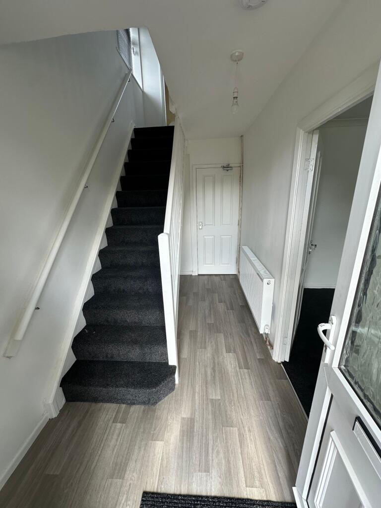 A clean and well-maintained hallway featuring l...