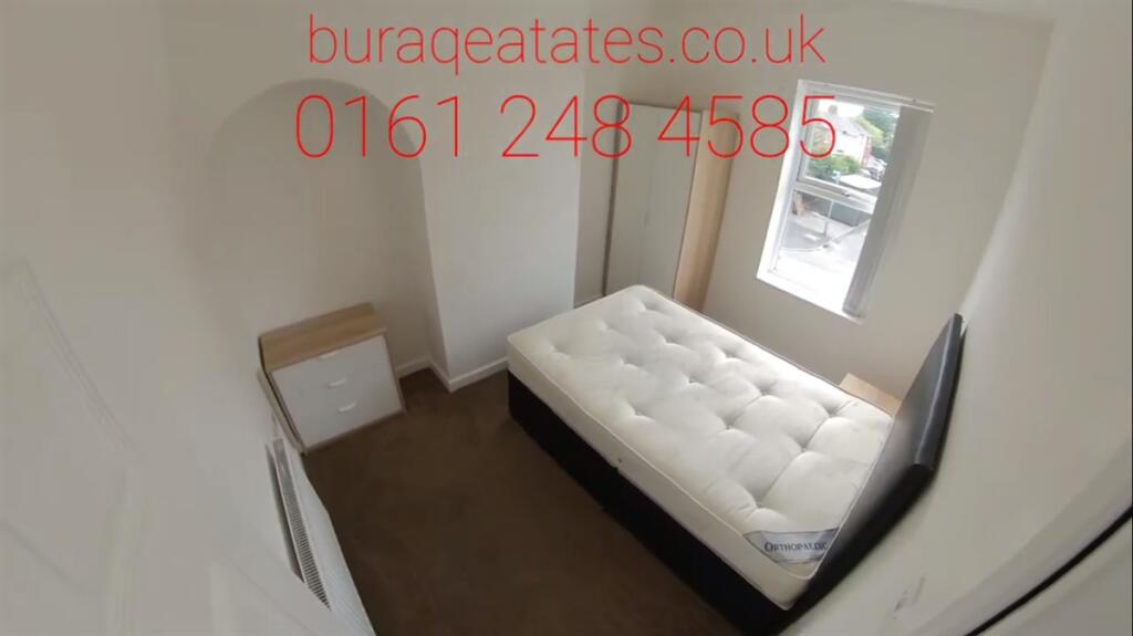 Cozy and tidy single bedroom featuring a comfor...