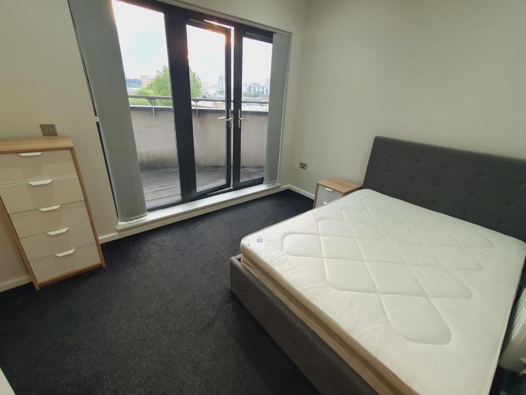 bedroom with en-suite and balcony