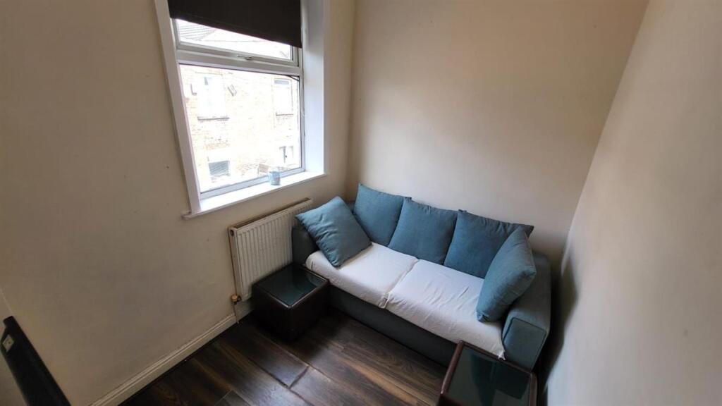 Bright and inviting living room featuring a com...