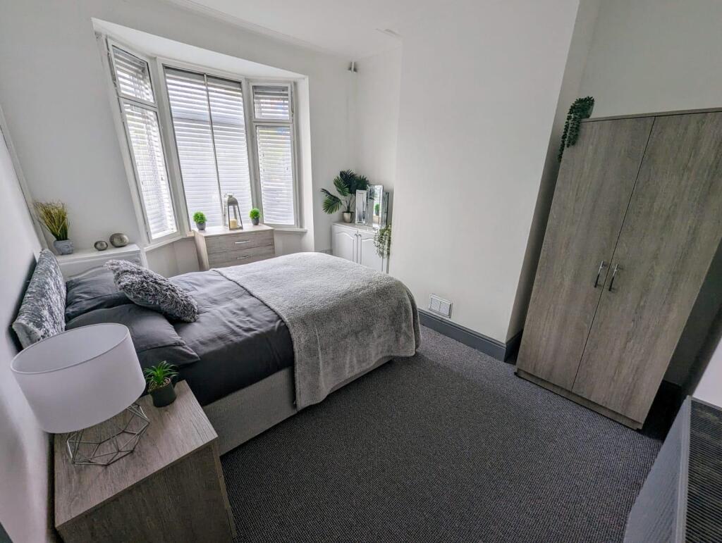 Bright and inviting double bedroom featuring a ...