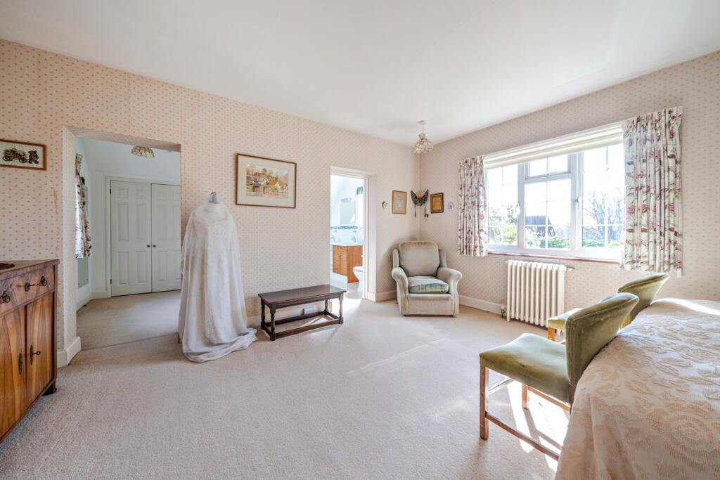 Master Bedroom with en suite bathroom and walk in dressing area